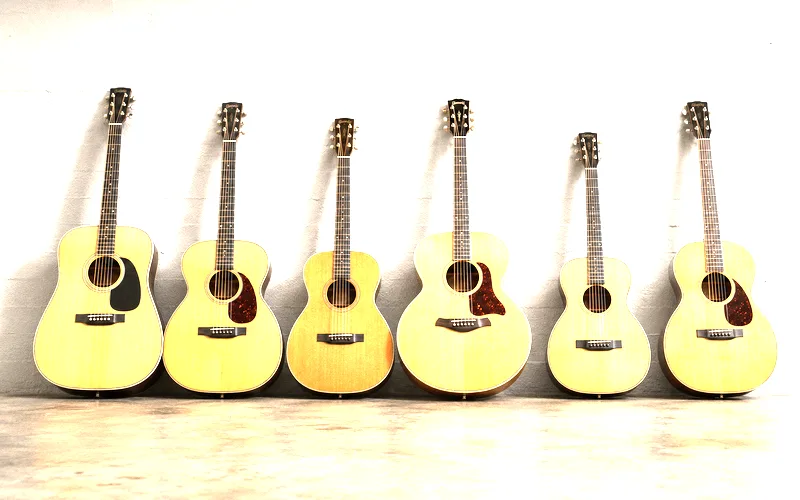 Six different acoustic guitar body shapes lined up side by side showing dreadnought, grand auditorium, concert, jumbo, parlor, and orchestra model sizes
