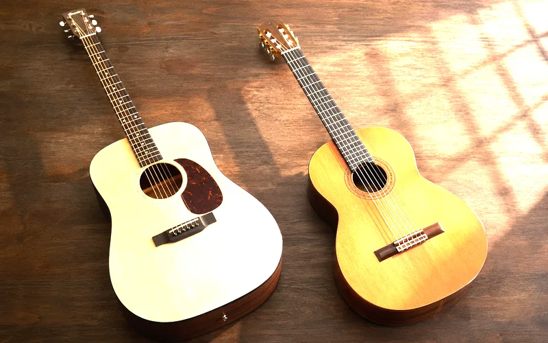 Close-up of steel string acoustic guitar next to a nylon string classical guitar showing the different string types and neck widths