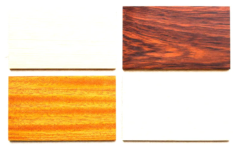 Close-up of different acoustic guitar tonewoods showing the grain patterns of spruce, rosewood, mahogany, and maple