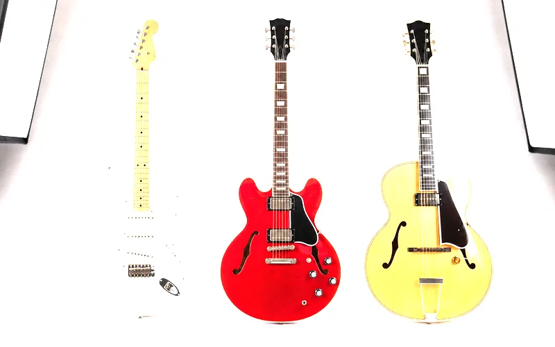 Three electric guitar construction types side by side showing solid body, semi-hollow body with center block cutaway, and fully hollow body electric guitar