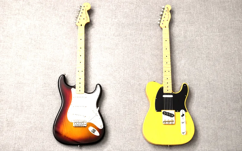 Fender Stratocaster and Telecaster electric guitars side by side showing the difference in body contours, pickups, and bridge design