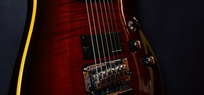 Seven string electric guitar with an extra low B string