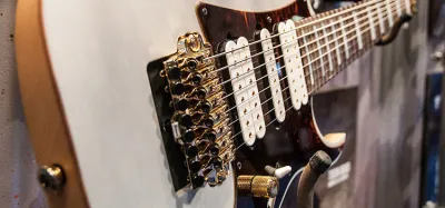 Close-up of humbucker pickups installed in an 8-string electric guitar