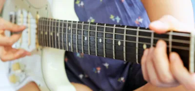 A hand-built Suhr electric guitar showing flawless woodwork and finish