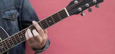 Guitar fretboard showing different ways to play an A major chord