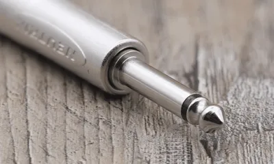 Close-up of a shielded guitar instrument cable with a quarter-inch plug