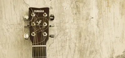 Yamaha acoustic guitar with solid spruce top and natural finish