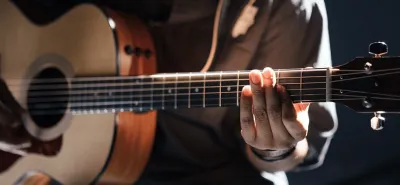 Acoustic-electric guitar with onboard preamp ready for stage use