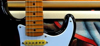 Tube combo amplifier paired with a Fender Stratocaster guitar