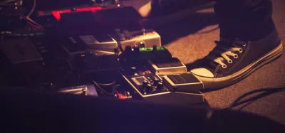 BOSS delay pedals lined up on a pedalboard