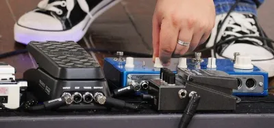 Budget reverb pedal on a guitar pedalboard