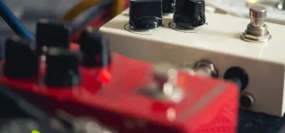 Chorus pedal on a pedalboard set up for acoustic guitar
