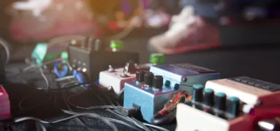 Chorus pedals lined up on a worship guitar pedalboard