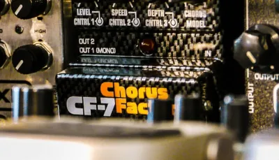 Lineup of the best chorus pedals under $100 on a pedalboard