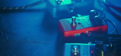 Delay pedals arranged on a pedalboard for acoustic guitar