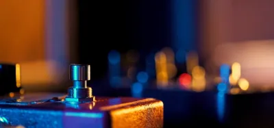 Guitar delay pedals lined up on a pedalboard