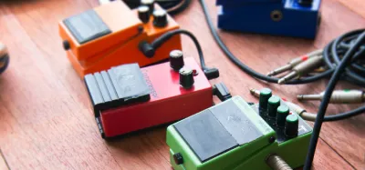 Best flanger pedals under $100 lined up on a guitar pedalboard