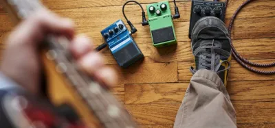 A row of fuzz pedals on a guitar pedalboard