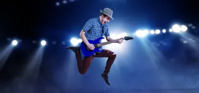 Wireless guitar system transmitter plugged into an electric guitar