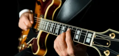 Semi-hollow archtop jazz guitar resting on an amp