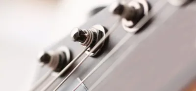 Locking tuners installed on an electric guitar headstock