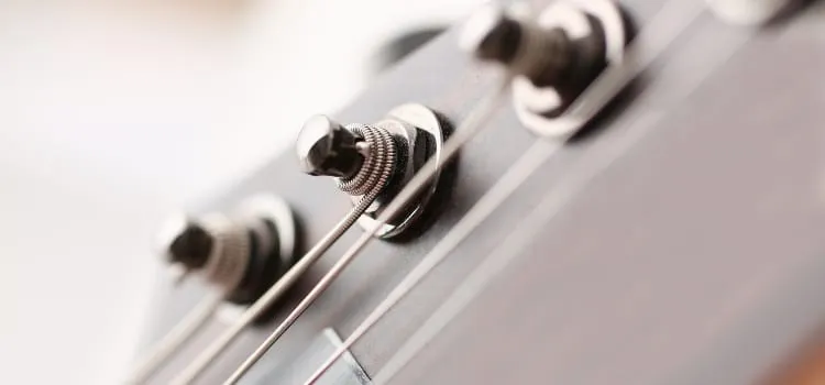 Locking tuners installed on an electric guitar headstock