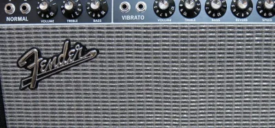 Overdrive pedals lined up in front of a Fender Deluxe Reverb amplifier
