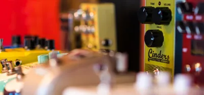 Overdrive pedals lined up on a pedalboard for metal guitar tone