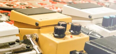 Row of guitar overdrive pedals on a pedalboard under $100