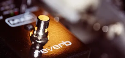 Guitar reverb pedals lined up on a pedalboard