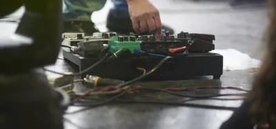 Small guitar pedalboard loaded with effects pedals