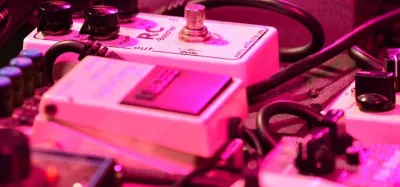 Spring reverb guitar effects pedals lined up on a pedalboard