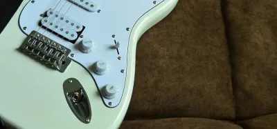 Super strat electric guitar with a Floyd Rose tremolo and HSS pickups