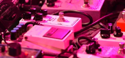 Tape delay pedals lined up on a guitar pedalboard