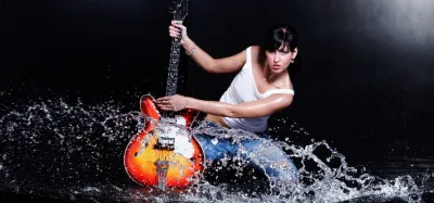 Electric guitar with water droplets on its lacquered body
