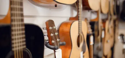 Cedar top and spruce top acoustic guitars side by side for comparison