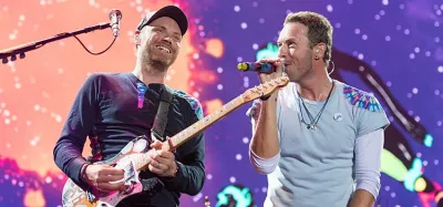 Acoustic guitar laid out for learning beginner Coldplay songs