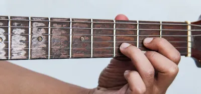 Guitar fretboard showing different ways to play a D major chord
