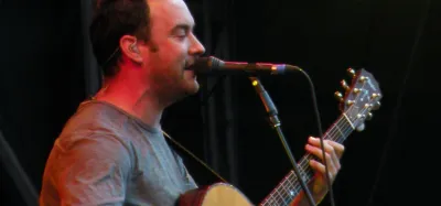 Dave Matthews performing live with his acoustic guitar
