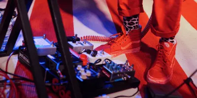 Overdrive, fuzz, and distortion guitar pedals lined up on a pedalboard
