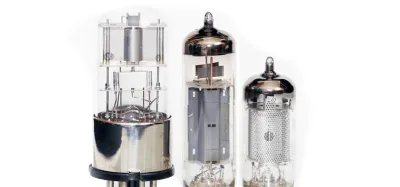 Glowing vacuum tubes inside the back of a guitar tube amplifier