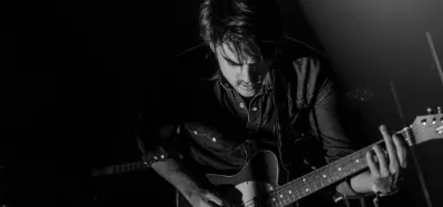 Electric guitar tuned a half step down to E flat tuning