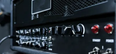 Back panel of a guitar amp showing the effects loop send and return jacks