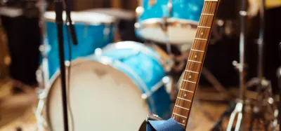 Close-up of guitar strings on an acoustic guitar headstock and tuners