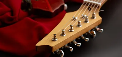 Repairing a broken guitar headstock at the neck joint with clamps and glue