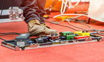 High gain distortion pedals lined up on a pedalboard for metal tone