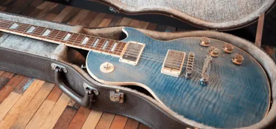 Cleaning and maintaining an acoustic guitar with a soft microfiber cloth