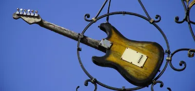 Reliced Stratocaster body showing worn nitro finish, dings, and aged hardware