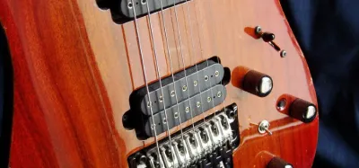 Player practicing the transition from a 6-string to a 7-string guitar