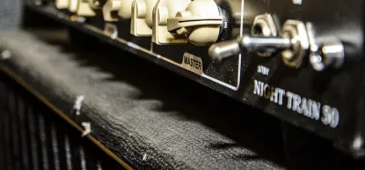 Close-up of a tube guitar amplifier control panel showing the power and standby switches